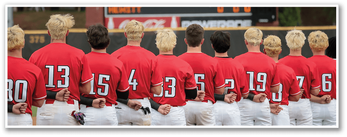 A group of young men wearing red shirts and white pants stand in front of a scoreboard. AI generated content