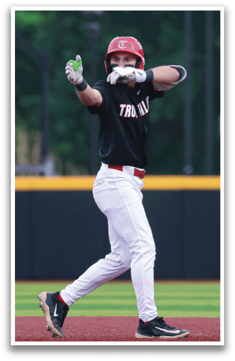 A baseball player wearing a black shirt and white pants is holding a green bottle. AI generated content