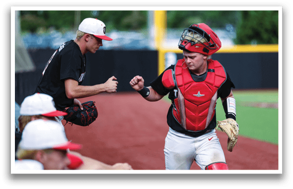 A baseball player wearing a red helmet and catcher's gear is walking on the field. AI generated content