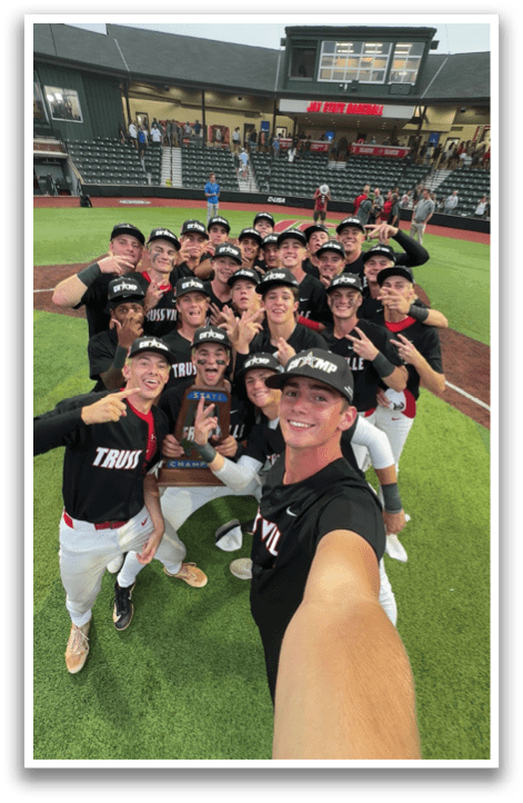 A group of baseball players pose for a photo on the field. AI generated content