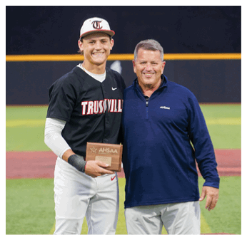A man holding a trophy stands next to another man on a baseball field. AI generated content