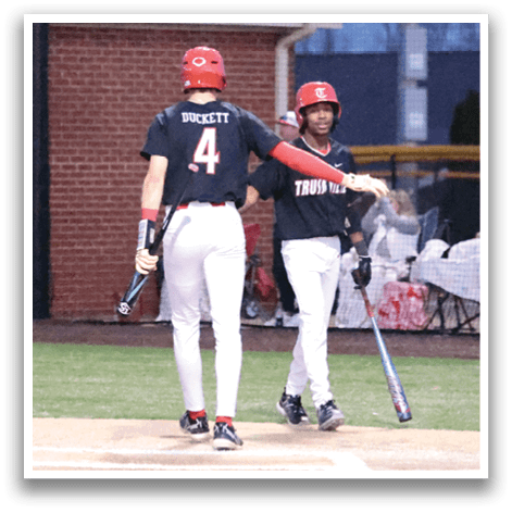 Two baseball players are standing on the field, one holding a bat and the other holding a baseball glove. They are both wearing baseball uniforms. AI generated content