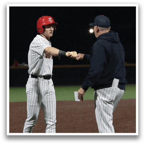 Two men are shaking hands on a baseball field. AI generated content