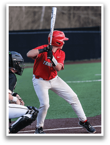 A baseball player in a red shirt and white pants is holding a bat, preparing to swing at a pitch. AI generated content