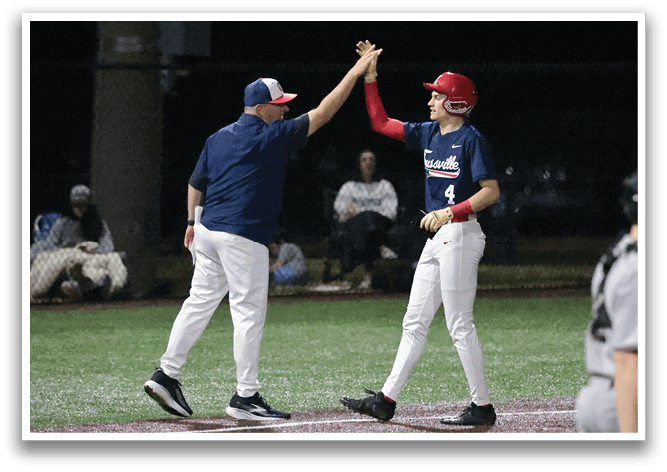 Two baseball players are high-fiving each other on the field. AI generated content