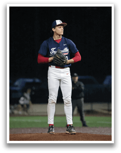 A baseball player in a blue uniform is standing on a field, holding a baseball glove. AI generated content