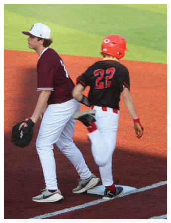 Two baseball players wearing white and red uniforms are walking on the field. AI generated content
