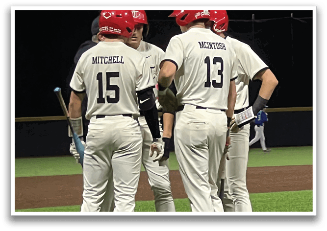 Three baseball players wearing white uniforms and red helmets are standing on the field. AI generated content