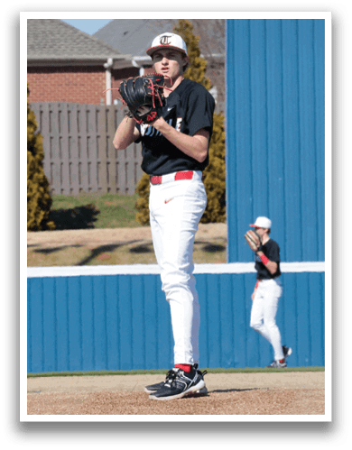 A baseball player in a black shirt and white pants is standing on a mound, holding a baseball glove. Another player is standing in the background, wearing a baseball glove as well. AI generated content