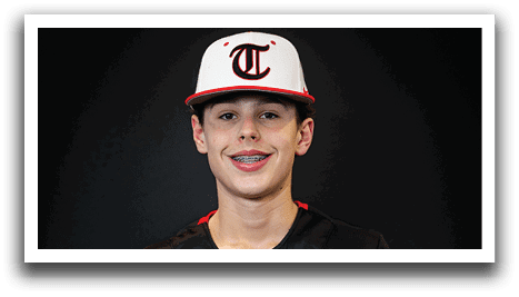A young man wearing a black and red baseball jersey with the word “Huskies" on the front. AI generated content