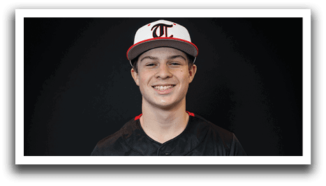 A young man wearing a baseball uniform with the word “Huskies" on the front. AI generated content