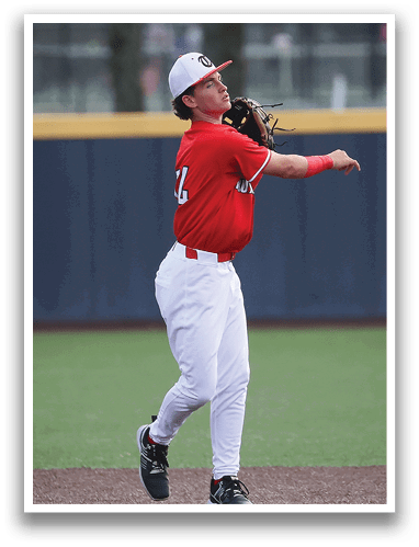 A baseball player in a red shirt and white pants is throwing a ball. AI generated content