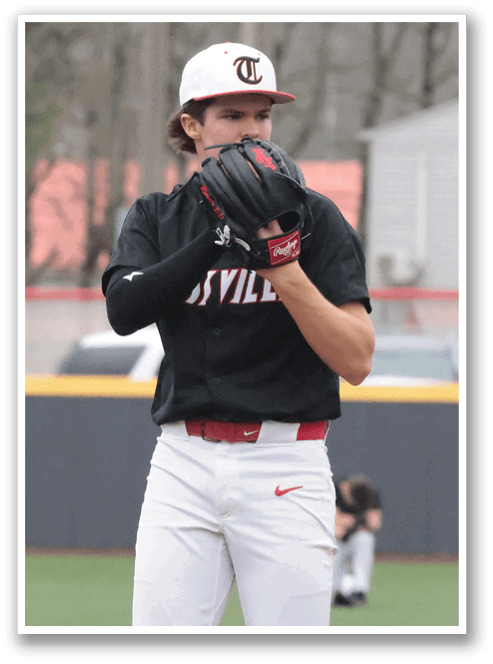 A baseball player wearing a black jersey and white pants is holding a baseball glove. AI generated content