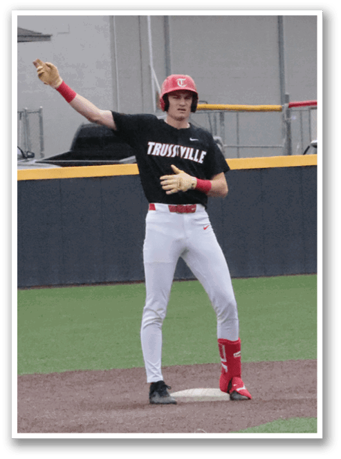 A baseball player in a black shirt and red hat is standing on a base, holding his glove up. Another player is walking by. AI generated content