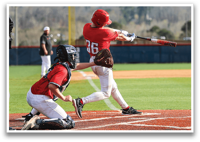 A baseball player in a red helmet is swinging a bat, attempting to hit a ball. The catcher is positioned behind him, ready to catch the ball if the batter misses. AI generated content