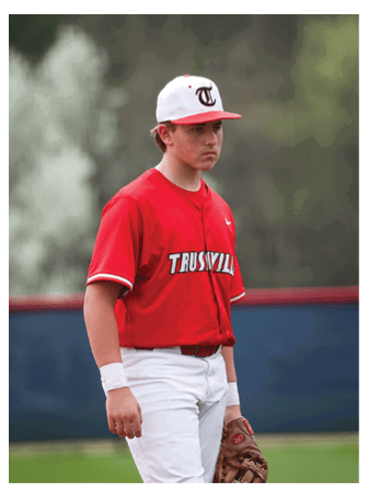 A baseball player wearing a red shirt and white pants stands on the field holding a baseball glove. AI generated content