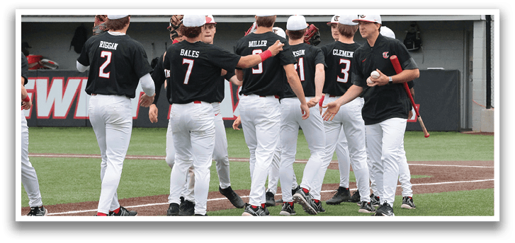 Baseball players wearing black and white uniforms are hugging each other on the field. AI generated content