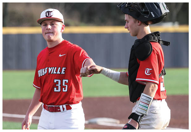 Two baseball players shake hands on the field. AI generated content