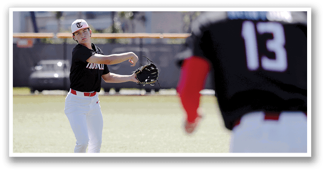 A baseball player in a black shirt and red sleeves is throwing a ball. AI generated content