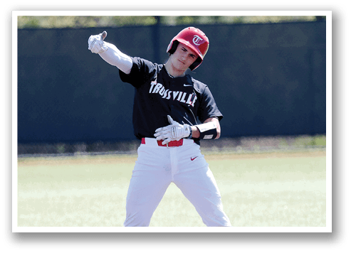 A baseball player in a black and red uniform is swinging a bat at a ball. AI generated content