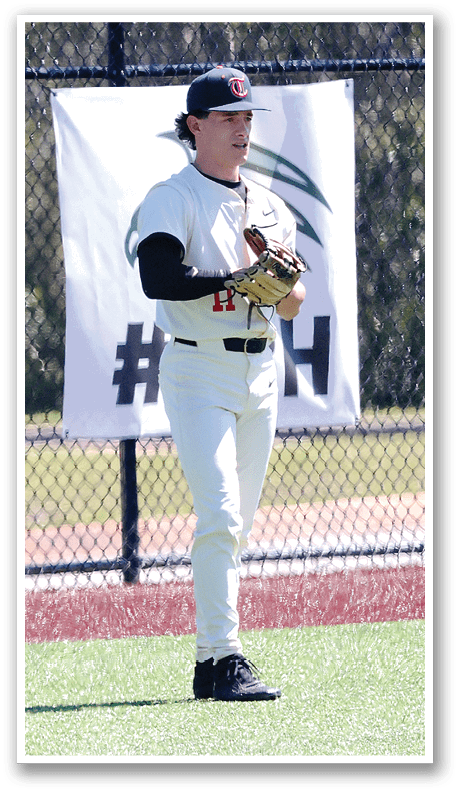 A baseball player wearing a white uniform stands on a field. AI generated content
