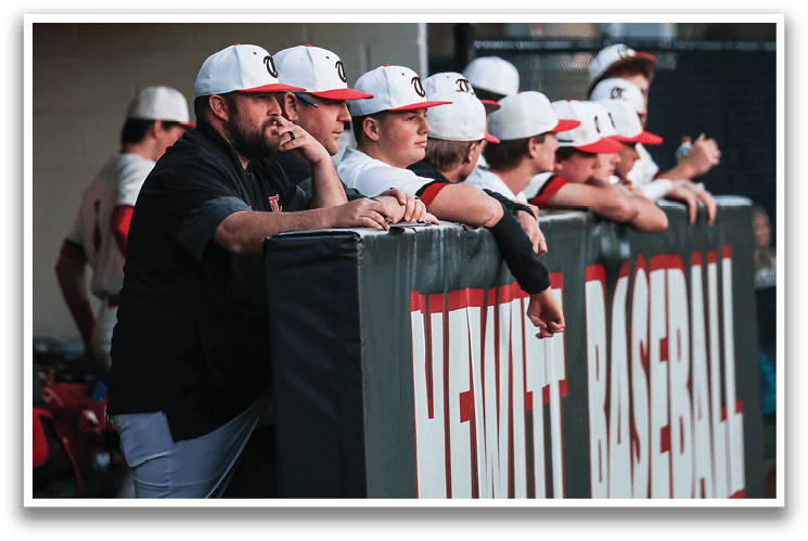 A group of baseball players are sitting on a bench, watching the game. AI generated content