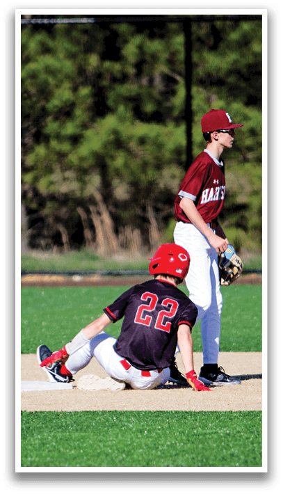 A baseball player is sitting on the ground with his glove on. AI generated content