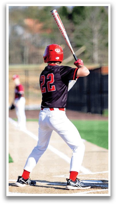 A baseball player in a black shirt and red helmet is holding a bat and getting ready to swing. AI generated content