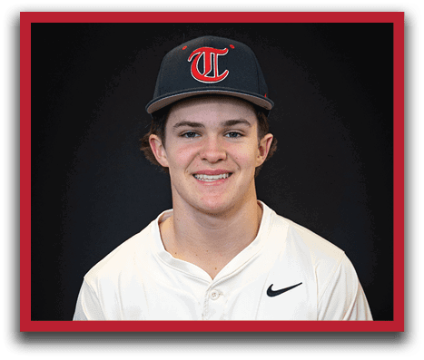 A young man wearing a baseball uniform and a blue hat with the letter T on it. AI generated content