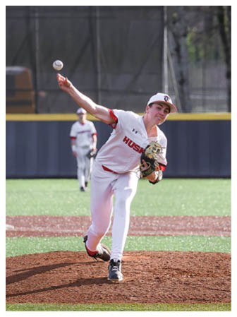 A baseball player is pitching a ball on a field. AI generated content