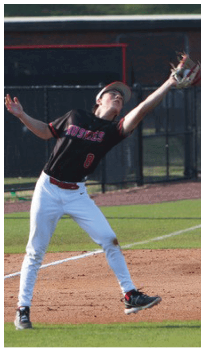 A baseball player catching a ball in a field. AI generated content