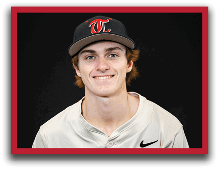 A young man wearing a baseball uniform and a black hat. AI generated content