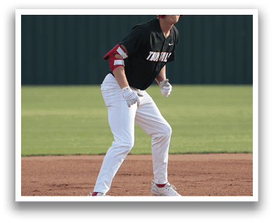 A baseball player in a black shirt and red helmet is running on the field. AI generated content