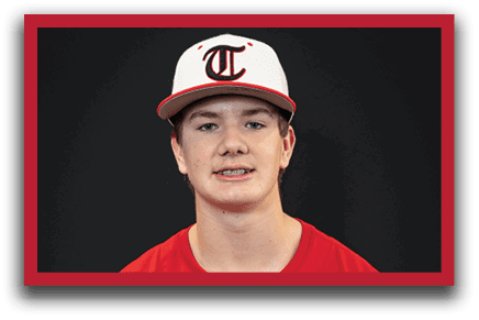 A young man wearing a red baseball jersey with the word “Trussville" on it. AI generated content