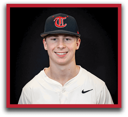 A young man wearing a baseball uniform and a black hat with a red T on it. AI generated content