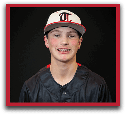 A young man wearing a black and white baseball uniform with the word “Huskies" on the front. AI generated content