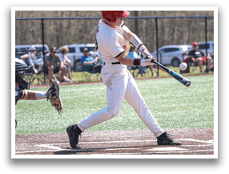 A baseball player in a white uniform is swinging a bat on a field. AI generated content