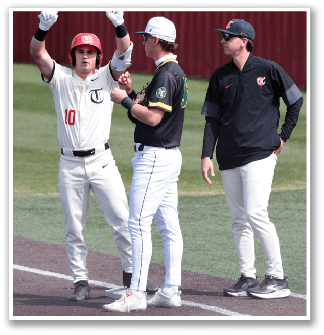 Three baseball players are standing on the field, talking to each other. One player is wearing a red hat and is holding his arms up. AI generated content