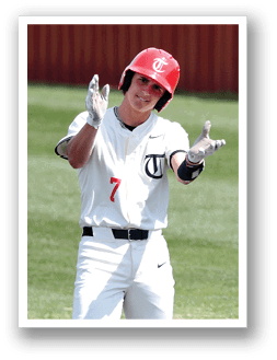 A baseball player in a white uniform is holding his hands up in the air. AI generated content