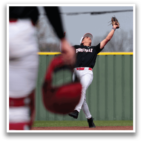 A baseball player wearing a black shirt and red hat is running towards a base. AI generated content