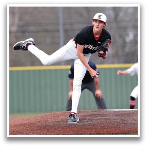 A baseball player in a black shirt and white pants is in the process of throwing a ball. AI generated content