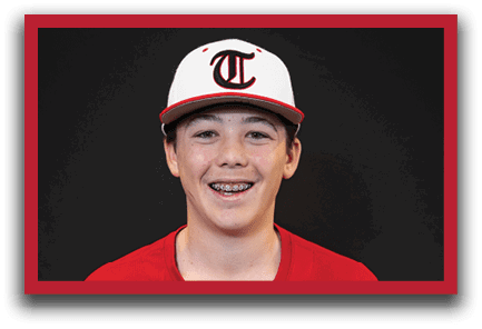 A young boy wearing a red baseball uniform with the word “trusville" on the front. AI generated content
