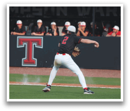A baseball player in a black shirt and white pants is throwing a ball on a field. AI generated content