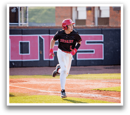 A baseball player wearing a red helmet and black shirt is running on the field. AI generated content
