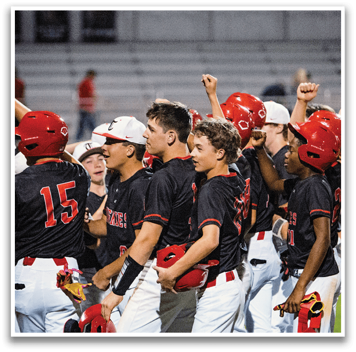 A group of baseball players wearing red helmets and black jerseys are standing on the field. AI generated content