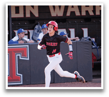 A baseball player wearing a black shirt and red helmet is running on the field. AI generated content