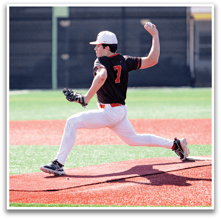 A baseball player in a black and red uniform is pitching a ball on a field. AI generated content
