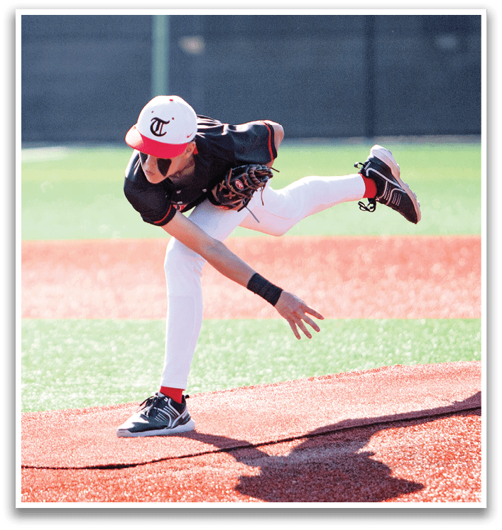 A baseball player in a black shirt and red hat is pitching a ball on a field. AI generated content