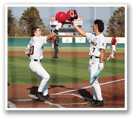 Two baseball players are high-fiving each other on the field. AI generated content