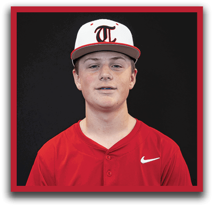 A young boy wearing a red baseball uniform with the word “Trussville" on the front. AI generated content